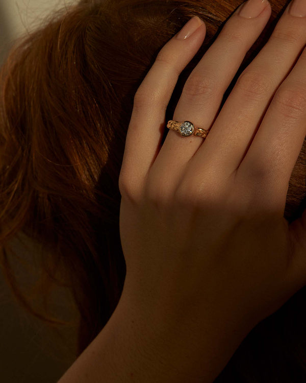 treccia engagement ring on the models hand