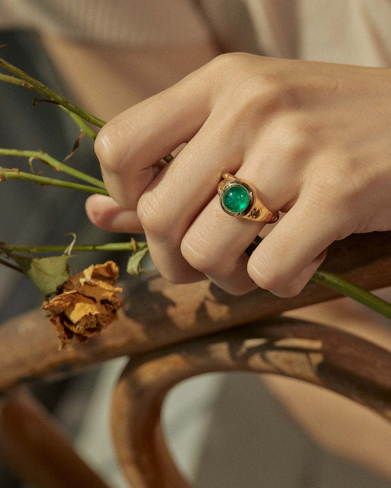 gold ring with muzo emerald