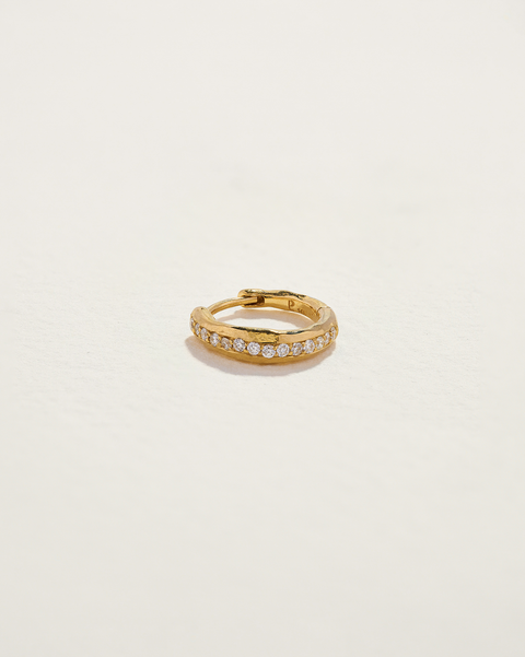 gold huggie earring with white diamonds