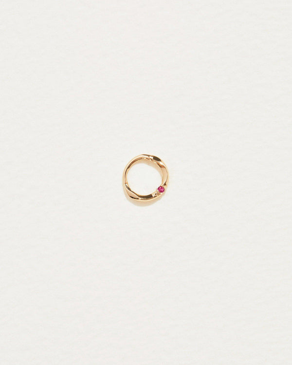 6mm floating ruby clicker piercing with 14k yellow gold