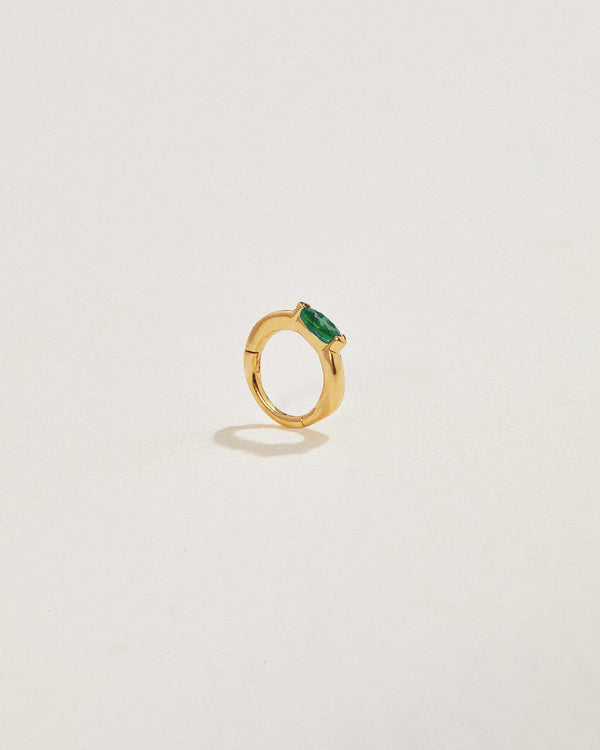 emerald clicker piercing made of 14k gold