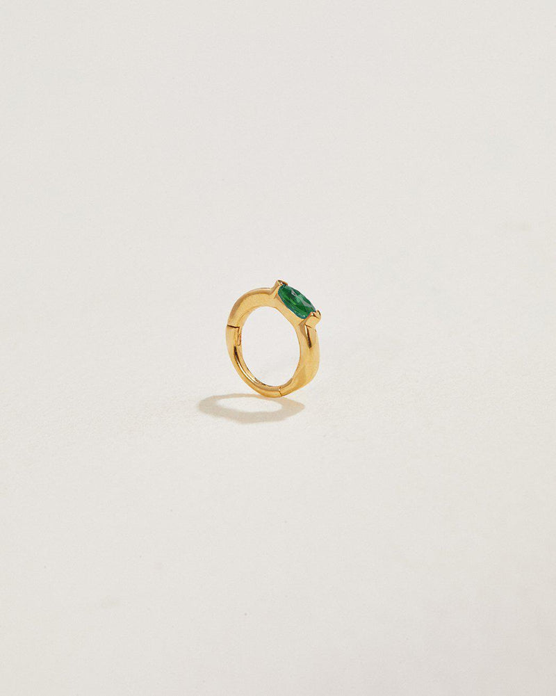 emerald clicker piercing made of 14k gold