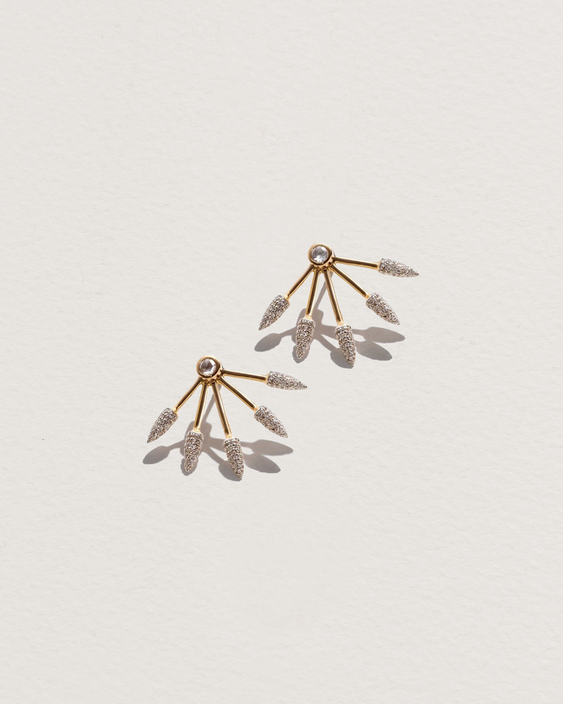 five spike earrings with gold and diamonds