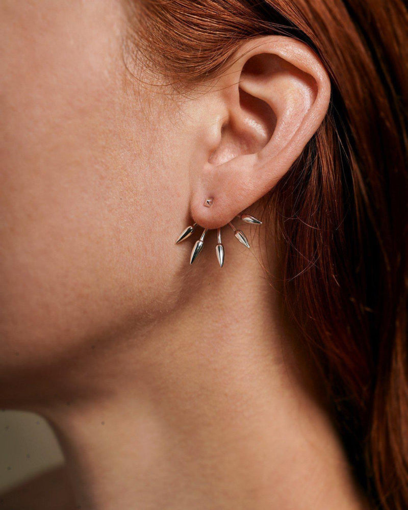 spike earrings on the model