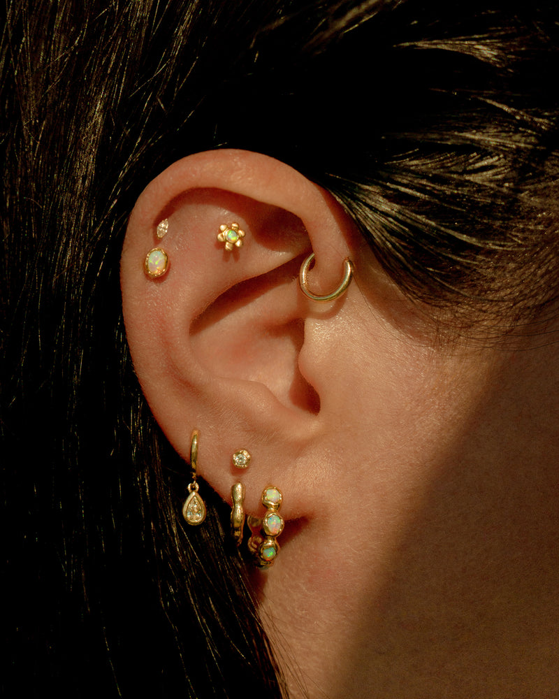 opal daisy stud earring on the model