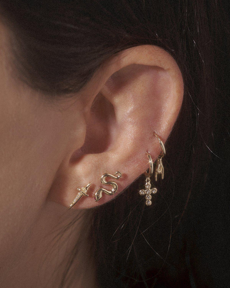 gold stud earrings on the model