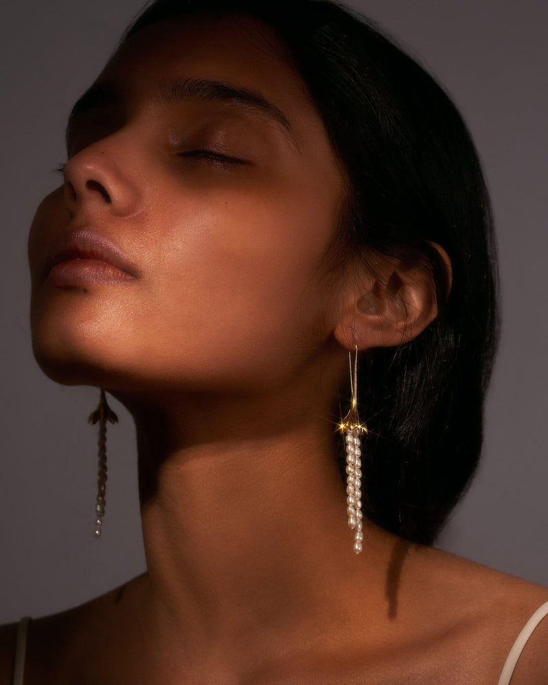 pearl drop earrings on the model