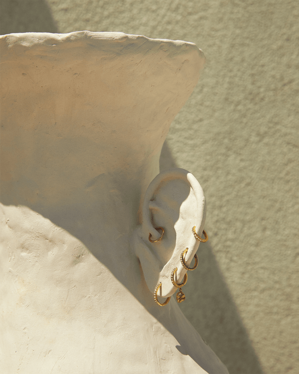 8mm Pavé Huggie by Pamela Love – Piercing in #product_material# (#product_color#).