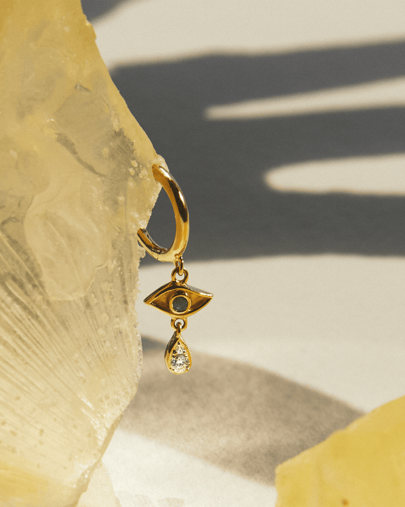 Crying Eye Huggie by Pamela Love – Piercing in #product_material# (#product_color#).