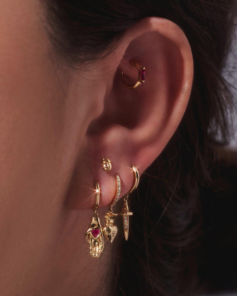 Heart in Hand Huggie by Pamela Love – Piercing in #product_material# (#product_color#).