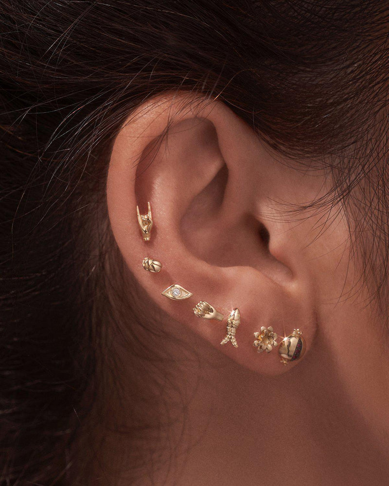gold stud piercings by pamela love